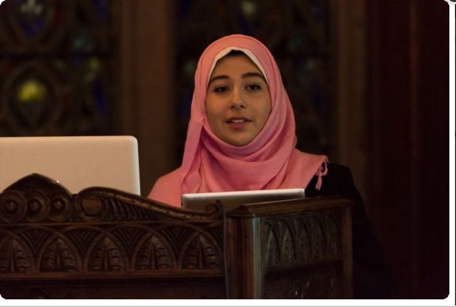 Soaad Elbahwati, who is president of Middle East and North Africa Club at The Hill School, introduces a speaker on Feb. 10 who presented a lecture to students on the Middle East, North Africa and ISIL