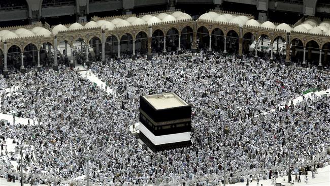 Muslim pilgrims prepare themselves for Friday prayers in front of the Ka’aba, Islam