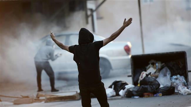 A Bahraini protester shouts slogans during clashes with riot police following a demonstration. (File photo by AFP)
