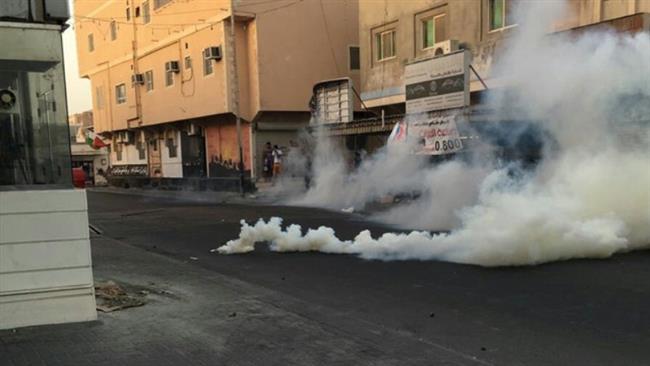Smoke billows from teargas canisters fired by Bahraini police against protesters in the capital, Manama, September 30, 2016