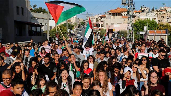 Palestinians living in the occupied territories march in Sakhnin on October 1, 2016, marking the 16th anniversary of the Second Palestinian Intifada. (Photo by Reuters)