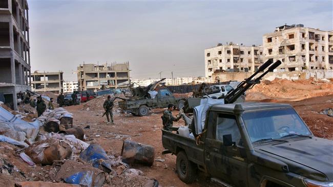 Syrian pro-government forces hold a position in Aleppo