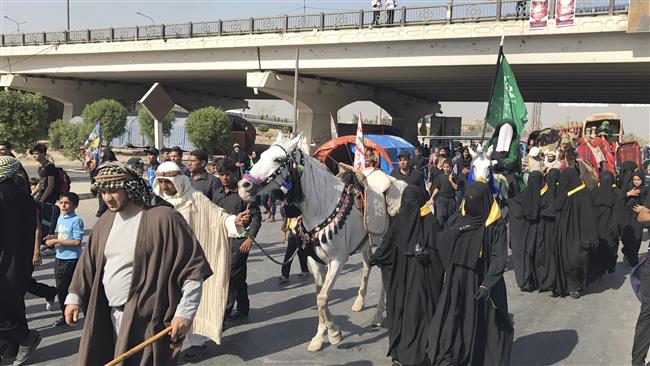 Muslim pilgrims walk to the holy city of Karbala, ahead of the holy ritual of Arba’een
