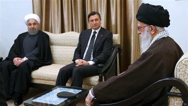 Iranian President Hassan Rouhani (L) participates in a meeting between Leader of the Islamic Revolution Ayatollah Seyyed Ali Khamenei (R) and Slovenia