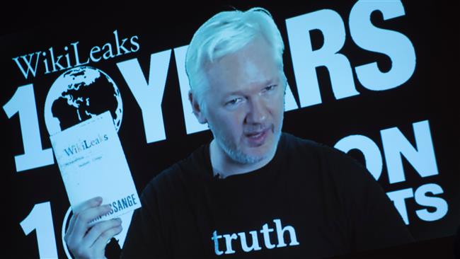Julian Assange, founder of the online leaking platform WikiLeaks, is seen on a screen as he addresses journalists via a live video connection during a press conference on the platform