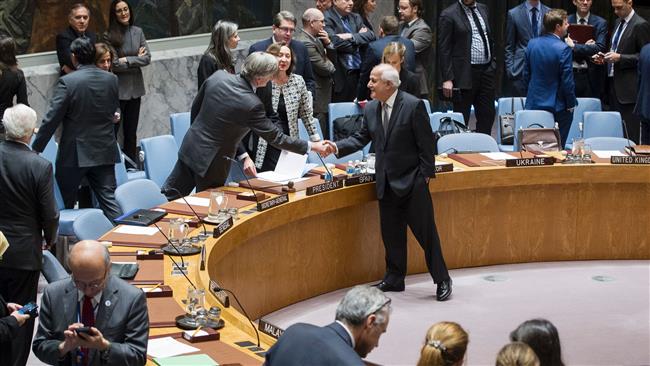 Riyad Mansour (C), the Permanent Observer of the State of Palestine to the UN, greets Roman Oyarzun Marchesi, Spain’s envoy and the president of the Security Council for December, before a Council vote on Israeli settlements, December 23, 2016. (Photo by AFP)
