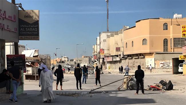 People protest in the Jidhafs district of Bahrain after the execution of three activists