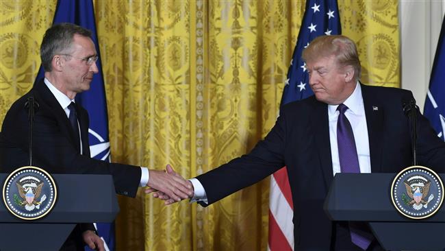 US President Donald Trump (R) and NATO Secretary General Jens Stoltenberg shake hands during a joint press conference in the White House in Washington, DC, on April 12, 2017. (AFP photo)
