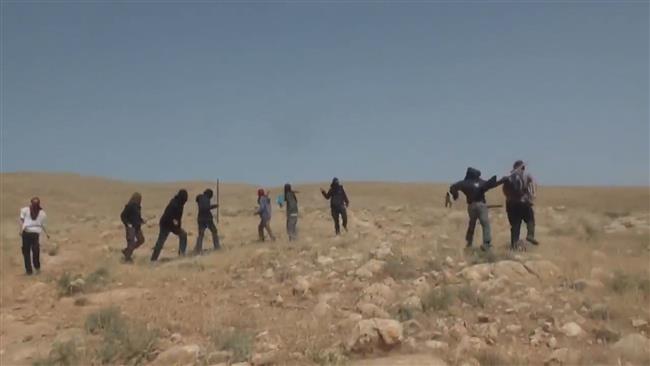 A screen grab from footage released by Ruptly on April 22, 2017 showing a group of Israeli settlers attack Palestinian shepherds.
