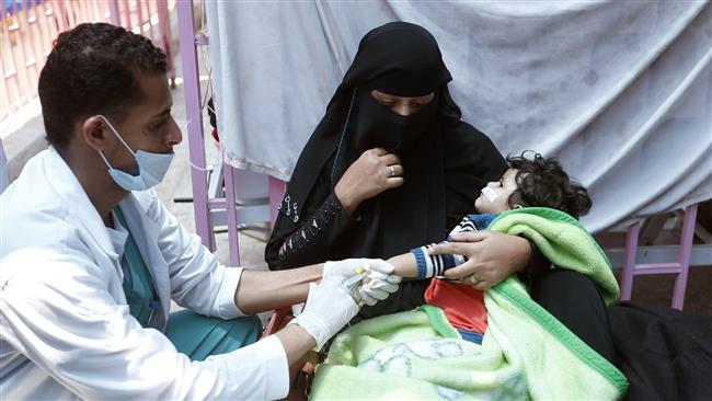 A Yemeni child suspected of being infected with cholera receives treatment at a hospital in Sana