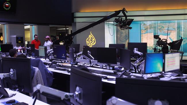 Staff work inside the headquarters of Al Jazeera Media Network, in Doha, Qatar, June 8, 2017. (Photo by Reuters)
