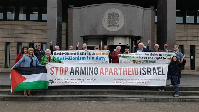 Activists from the Scottish Palestine Solidarity Campaign protest against Israel outside the Glasgow Sheriff Court in Scotland, on 10 July 2017.
