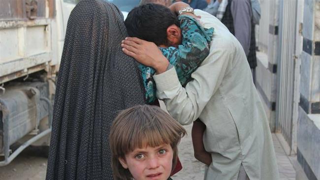 The members of an Afghan family try to comfort each other after losing loved ones in a Taliban raid on the Shia village of Mirza Olang in the northern Afghan province of Sar-e Pol on August 6, 2017.
