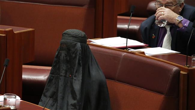 Australian senator Pauline Hanson wears a burqa in the Senate chamber at Parliament House in Canberra, Australia, August 17, 2017. (Photo by AP)
