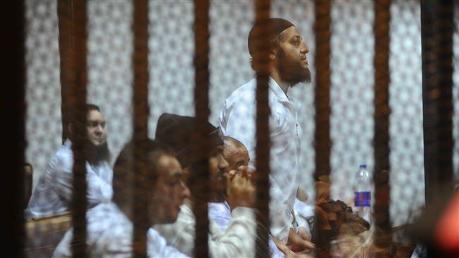 This file photo shows members of the Ajnad Misr group during a court hearing in Giza, near Cairo, Egypt.
