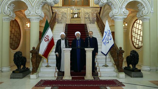 Iranian President Hassan Rouhani (center) Iranian Judiciary Chief Sadeq Larijani (L) Iranian Parliament speaker Ali Larijani during a joint press conference held on October 30, 2017. (Photo via IRNA)
