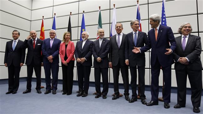 Senior diplomats of Iran and the P5+1 states pose for a group picture at the United Nations building in Vienna, Austria, July 14, 2015.

