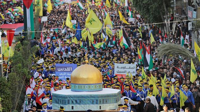 Lebanese demonstrators march with a model of the Dome of the Rock in the al-Aqsa Mosque compound along with their national flags and the flags of Palestine and the resistance movement Hezbollah during a protest in the capital Beirut on December 11, 2017. (Photo by AFP)
