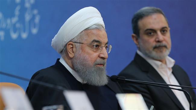Iranian President Hassan Rouhani (1st-L) addresses a summit in Tehran on December 19, 2017, on the occasion of the first anniversary of the introduction of the Charter of Citizens