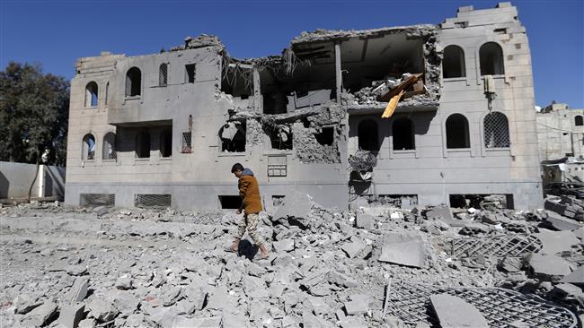 Yemenis check the site of airstrikes at a detention center in the capital Sana