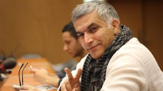 Bahraini human rights activist Nabeel Rajab flashes the victory sign during trial on February 21, 2018.