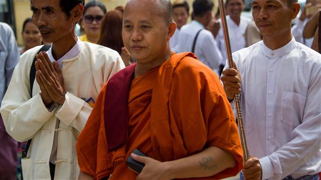Myanmar’s hawkish monk Wirathu (C) arrives at a monastery to give a public speech, in Yangon, Myanmar, March 10, 2018. (Photo by AFP)
