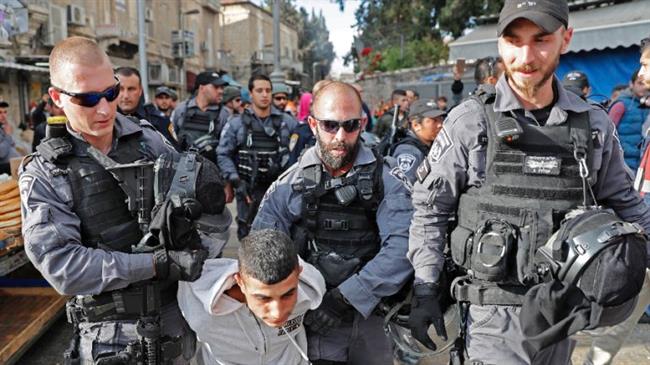 In this file picture, Israeli military forces detain a Palestinian youth in the occupied Old City of Jerusalem al-Quds. (Photo by AFP)
