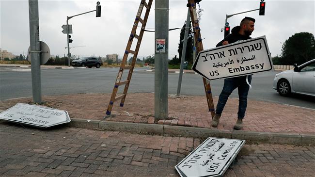 New road sign indicating the way to the new US embassy in Jerusalem al-Quds is set up on May 7, 2018. The embassy move from Tel Aviv to Jerusalem al-Quds is expected to occur on May 14. (Photo by AFP)
