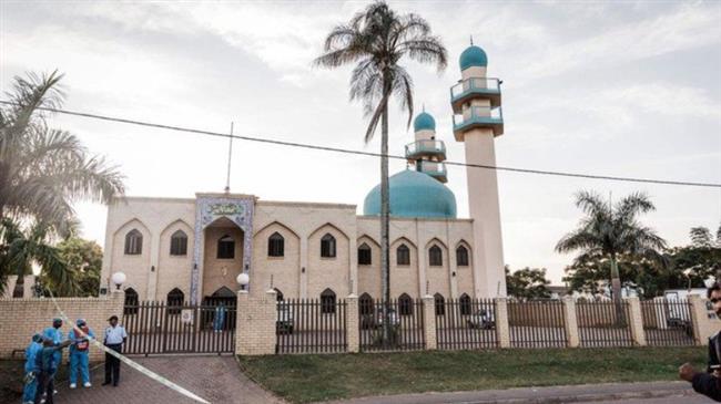 Police investigators gather at the entrance to the Imam Hussain Mosque on the outskirts of Durban on May 10, 2018, after an attack which left one person dead and two injured. (Photo by AFP)
