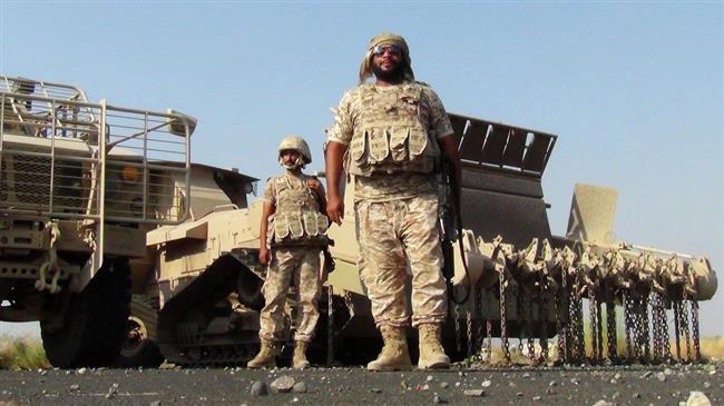 Emirati soldiers stand during rehabilitation and demining operations at the al-Anad airbase in Lahij Province, Yemen, October 5, 2015. (Photo by AFP)
