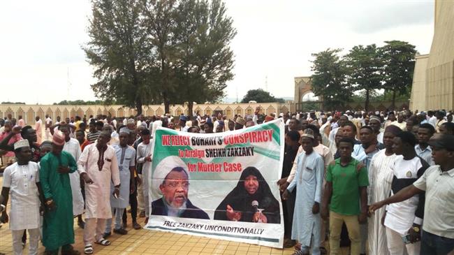 Supporters march with a banner to press for the release of Nigerian Muslim cleric Ibrahim Zakzaky.
