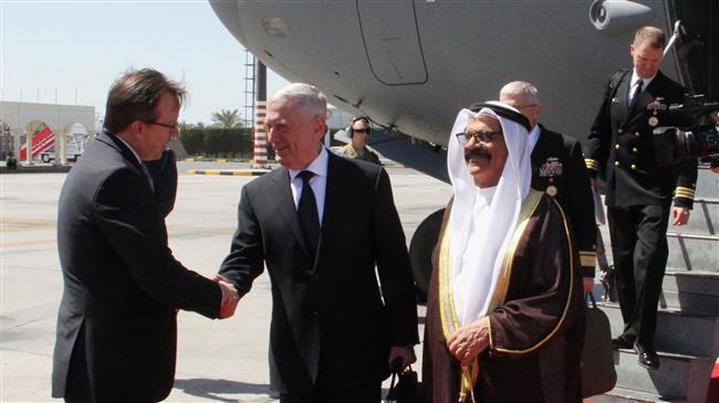 US Defense Secretary Jim Mattis (C) is welcomed by Bahraini Minister for Defense Affairs
