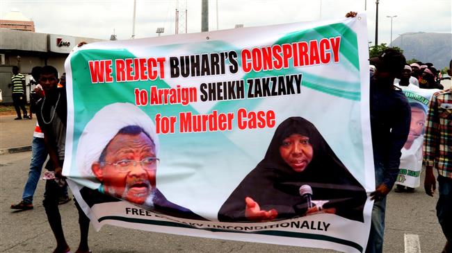 Supporters march with a banner to press for the release of Nigerian Shia Muslim cleric Ibrahim Zakzaky and his wife in the capital Abuja, Nigeria, May 14, 2018. (Photo by AFP)
