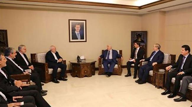 Iranian Foreign Minister Mohammad Javad Zarif (4th L) and his Syrian counterpart, Walid al-Muallem, meet in Damascus, Syria, on September 3, 2018.
