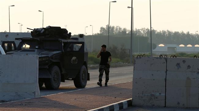 A Saudi soldier walks next to an armored vehicle in the town of Awamiyah during a crackdown on Shia Muslims in the eastern part of Saudi Arabia, August 9, 2017. (Photo by Reuters)
