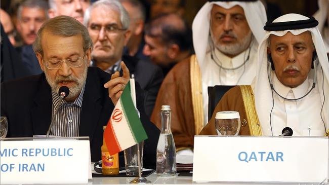 Iranian Parliament Speaker Ali Larijani (L) addresses the third meeting of the speakers of the Eurasia countries