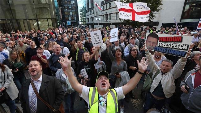 Supporters of a prominent British far-right activist demonstrate outside The Old Bailey, London