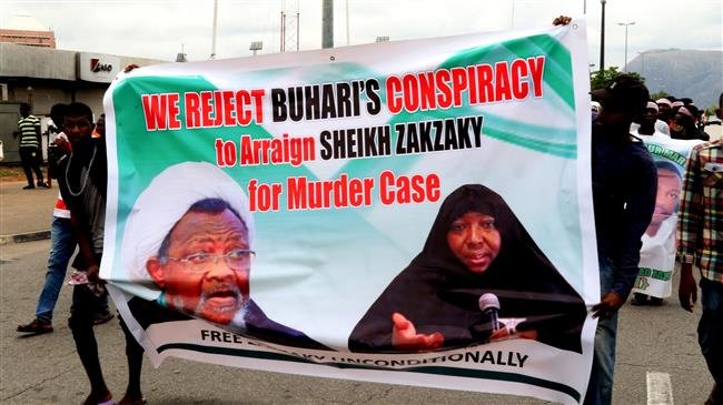 The file photo shows supporters marching with a banner to press for the release of Nigerian Muslim cleric Ibrahim Zakzaky on May 14, 2018 in Abuja. (Photo by AFP)
