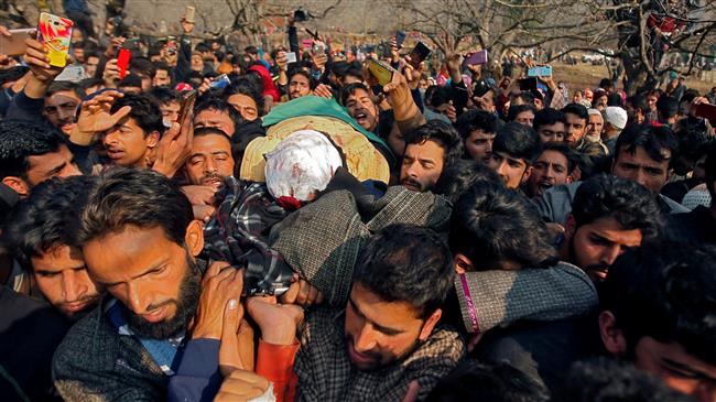 People carry the body of Hafeezullah Mir, a Kashmiri separatist leader, who according to local media was killed by unidentified gunmen, before his funeral in south Kashmir