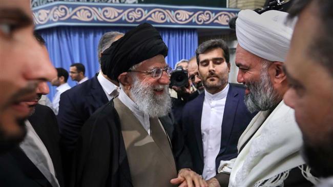 Ayatollah Khamenei greets a Sunni scholar during a meeting with participants at an international Islamic unity conference in Tehran, Nov. 25, 2018.
