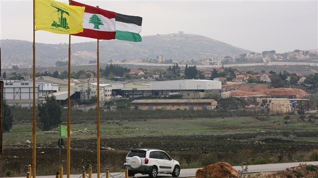Flags of Hezbollah, Lebanon and Palestine are seen fluttering in the southern town of Khiam, Lebanon, December 4, 2018. (Photo by Reuters)
