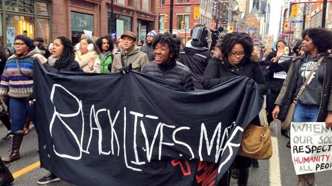 Demonstrators protest police brutality against black residents in a Black Lives Matter rally in Toronto, Canada. (File photo)
