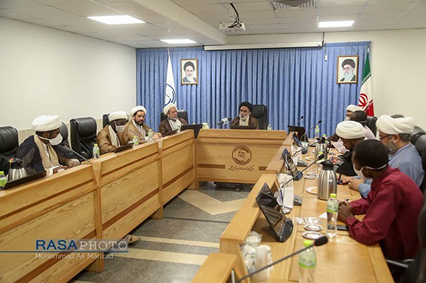 A number of non-Iranian clergyman meet with the head of the center for services of islamic seminaries