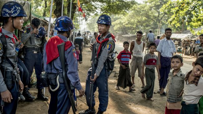 Police forces are seen at a Rohingya camp in Myanmar