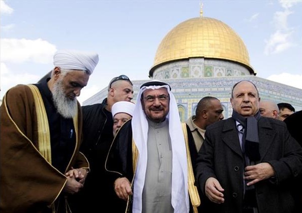 Iyad Madani, center, Secretary-General of the 57-nation Organization of Islamic Cooperation, stands in front of the Dome of the Rock shrine in Jerusalem