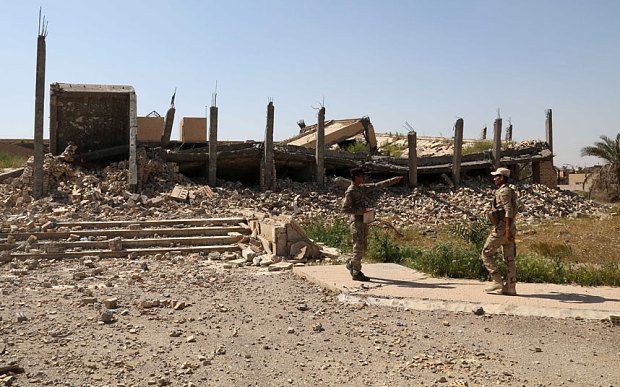 The destroyed tomb of Saddam Hussein