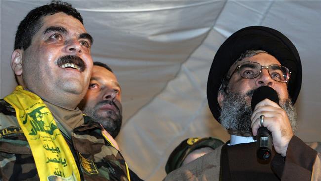 Nasrallah speaking next to Samir Qantar