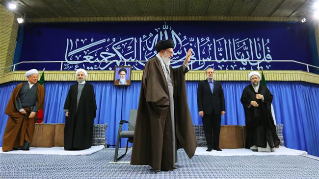 Ayatollah Khamenei waves to a group of state officials in Tehran, May ۵, ۲۰۱۶.
