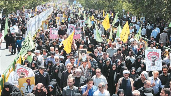 Iranians are seen during International al-Quds Day rallies in the capital, Tehran, in June ۲۰۱۵