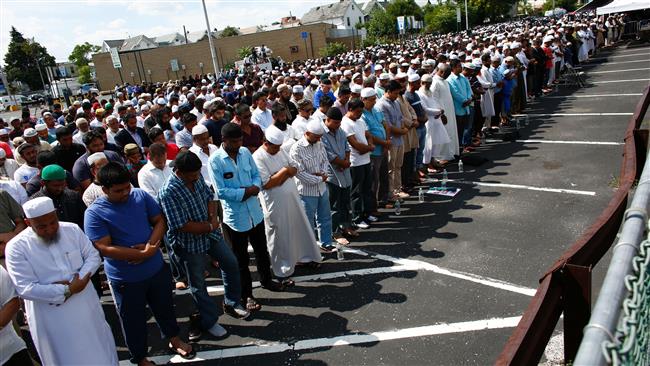 Community members gather for funeral prayers for Imam Maulana Akonjee